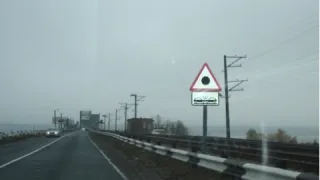 Traffic rules lessons: what does a red triangle with a black dot inside mean