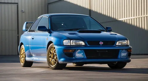 An old 23-year-old Subaru went under the hammer at the price of a Ferrari and Lamborghini