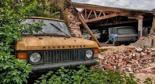 In Europe, a barn with abandoned Range Rovers and Mercedes was found