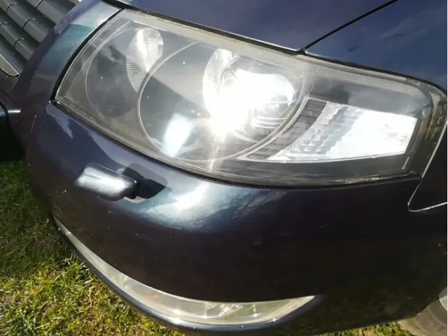 How to turn on the headlight washer in a car?
