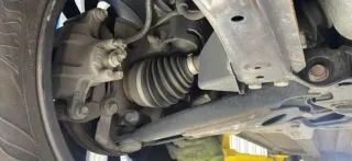 Where is the CV joint located in a car?