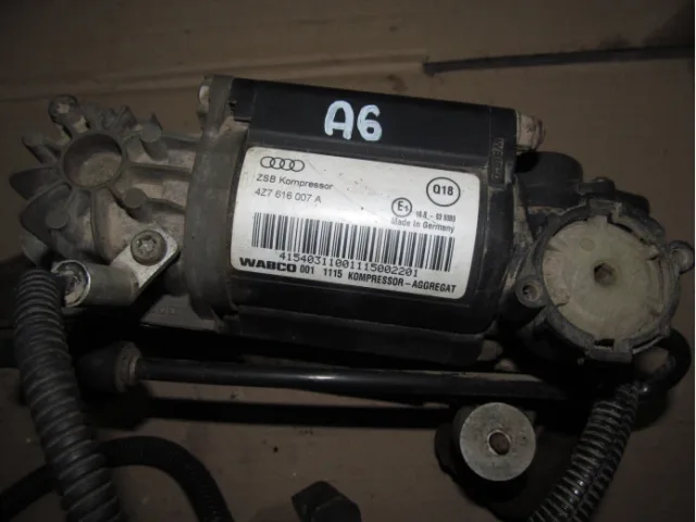 Where is the air suspension compressor located?