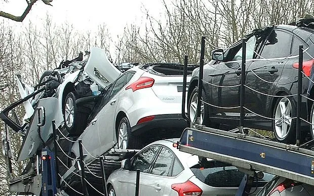 brand-new-ford-cars-destroyed-after-transporter-takes-shortcut-and-hits-a-bridge_2.jpg
