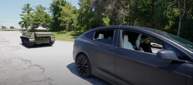 tesla_model_x_does_tug_of_war_with_military_tank_drag_races_.jpg