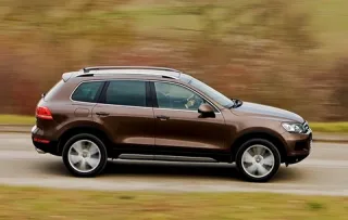 Три машини і гібрид. Яким має і не має бути новий Volkswagen Touareg