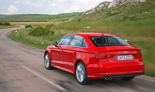 We go around the three-box Audi A3 Limousine from the rear