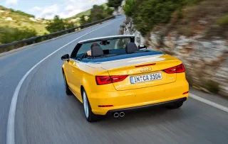 Chasing the Audi S3 sedan in a two-door Audi A3 Cabriolet