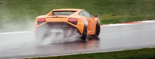 We're driving around Moscow Raceway in the Lamborghini Aventador and Gallardo coupes