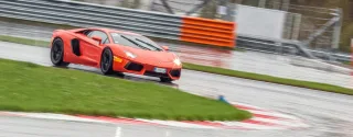 We're driving around Moscow Raceway in the Lamborghini Aventador and Gallardo coupes